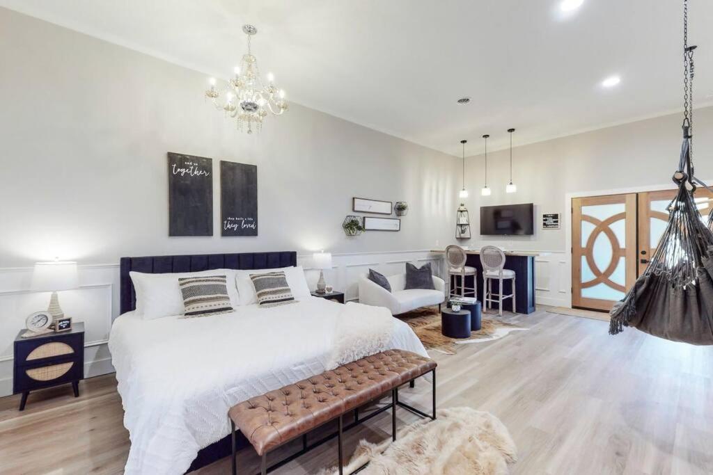 a bedroom with a large bed and a living room at Eternal Romance-The Honeymoon Suite at 1885 Farms in Navarre