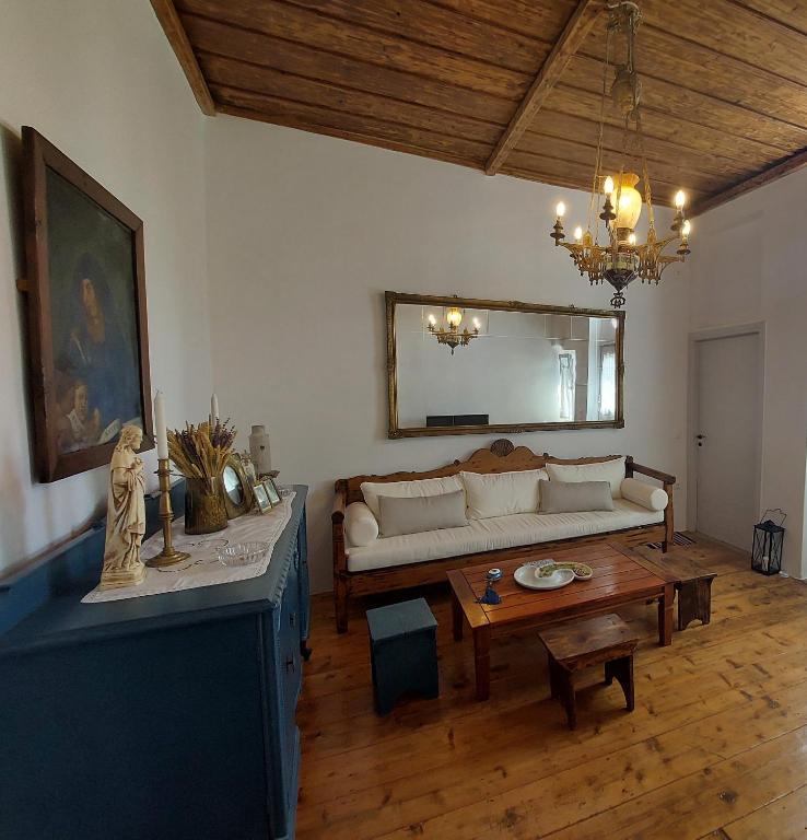 a living room with a couch and a table at La Belle House in Kalloni in Kalloni Tinou