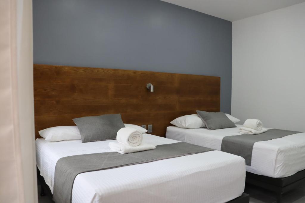 Postel nebo postele na pokoji v ubytování Hotel Riviera