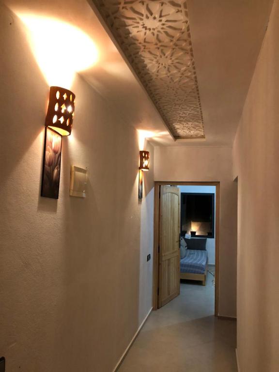 a room with a hallway with a ceiling and a door at apartment vue Mer in Agadir