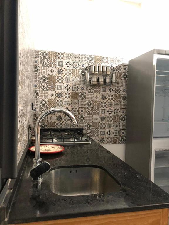 a kitchen counter with a sink in a kitchen at apartment vue Mer in Agadir