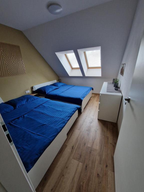Postel nebo postele na pokoji v ubytování Apartmán Eliška Filipovice