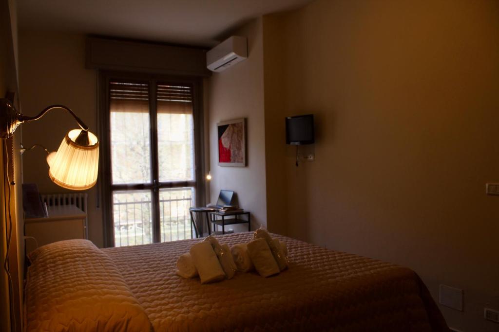 Postel nebo postele na pokoji v ubytování Art Hotel Pandos
