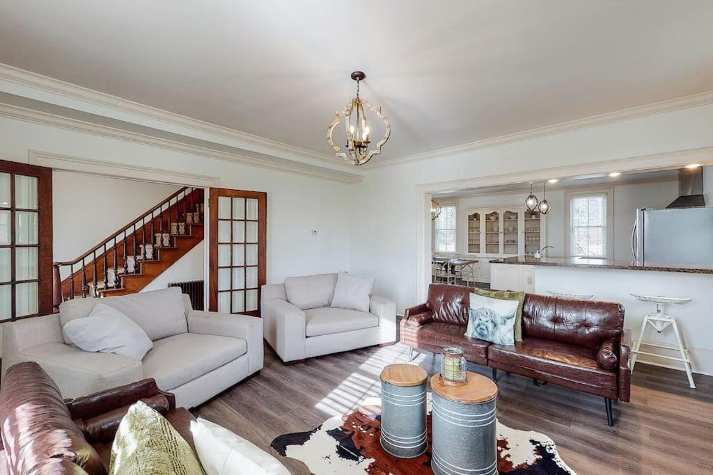 a living room with a couch and a table at The Farmhouse at 1885-Where Past Meets Present in Navarre