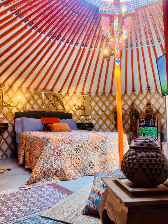 Postel nebo postele na pokoji v ubytování Yurta Arco Iris
