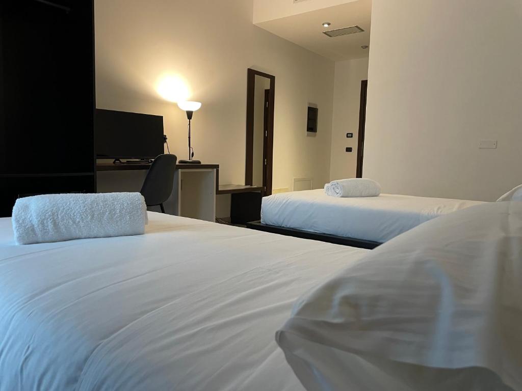 Postel nebo postele na pokoji v ubytování Maestrale Resort Hotel - Grosseto