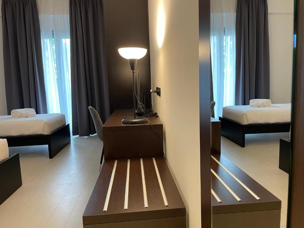 Postel nebo postele na pokoji v ubytování Maestrale Resort Hotel - Grosseto