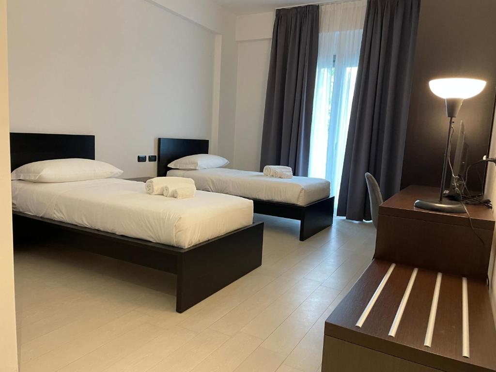 Postel nebo postele na pokoji v ubytování Maestrale Resort Hotel - Grosseto