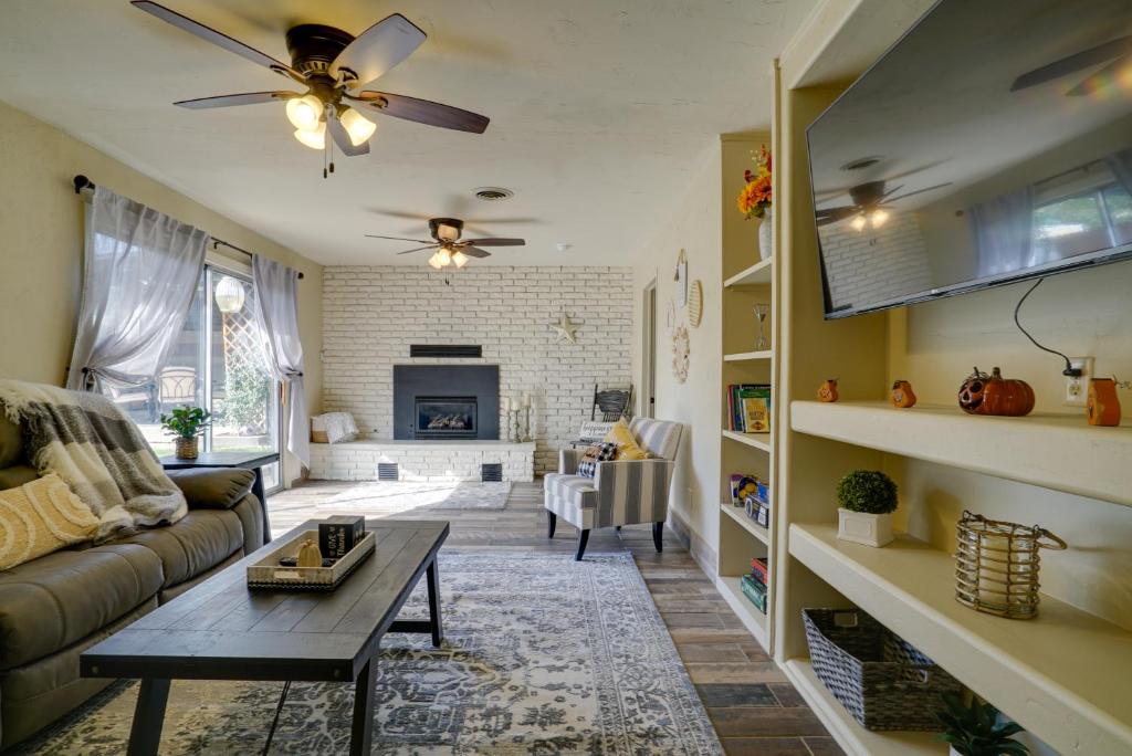 a living room with a couch and a table at Chic Silver City Getaway with Patio and Gas Grill in Silver City