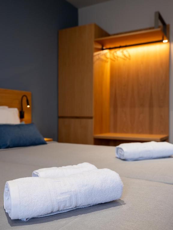 Postel nebo postele na pokoji v ubytování Athinaiko Hotel