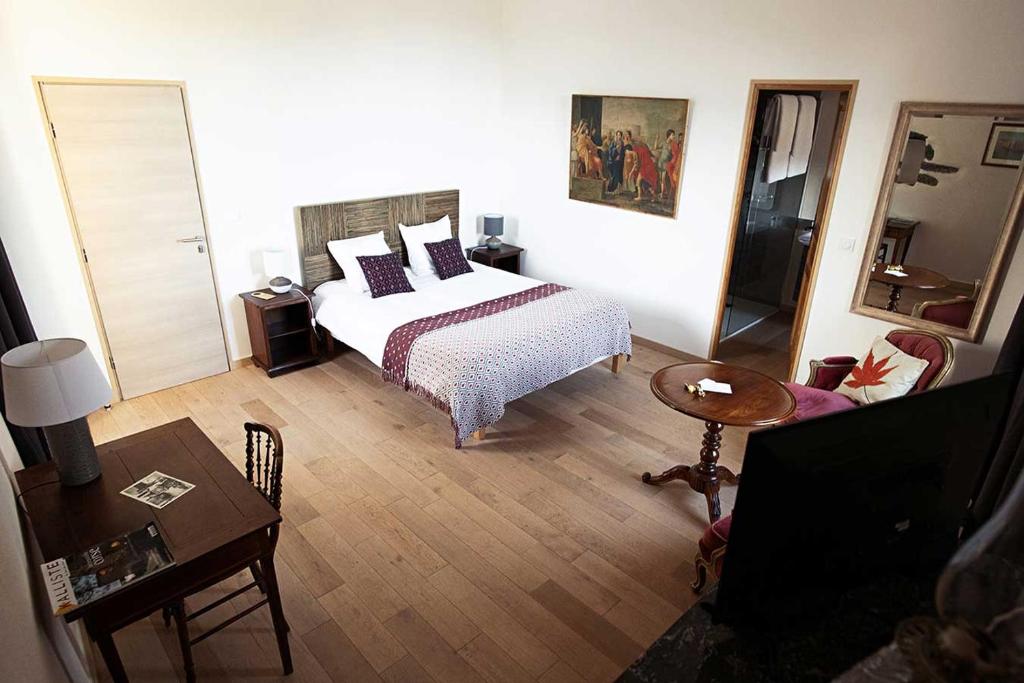 Postel nebo postele na pokoji v ubytování Castellu d'Orezza