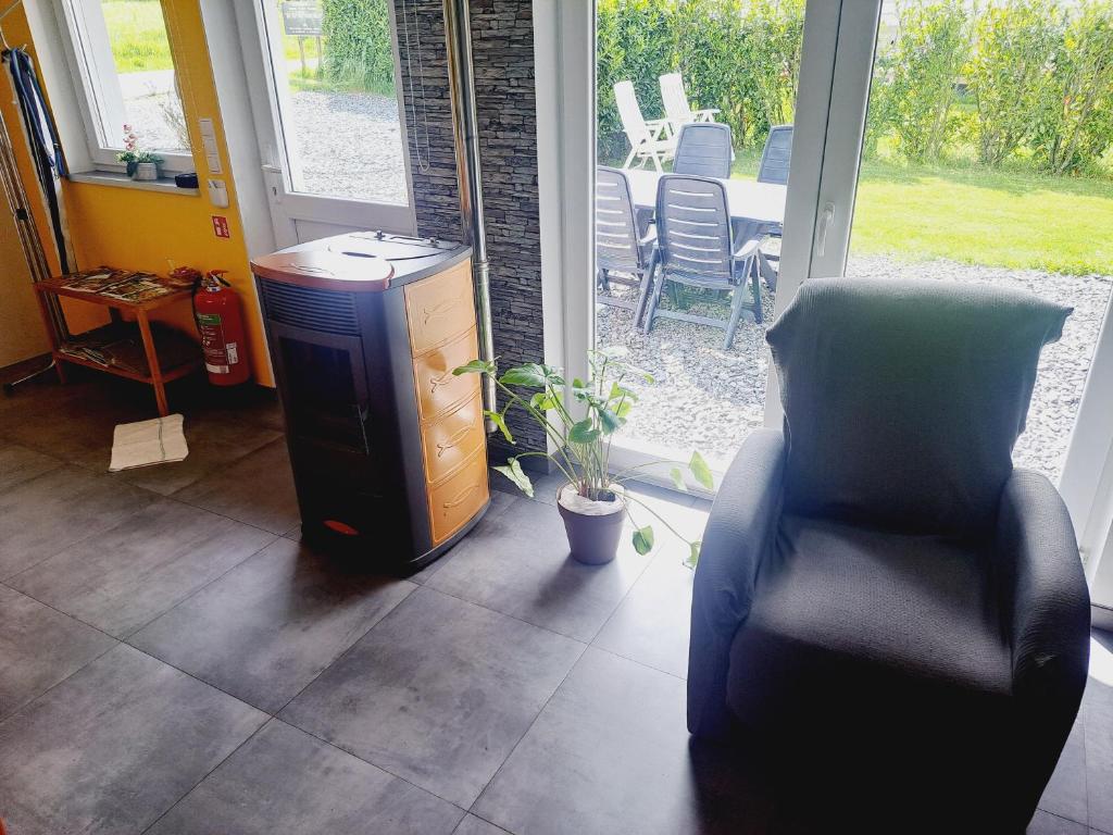 Posezení v ubytování *Au Refuge Ardennais*