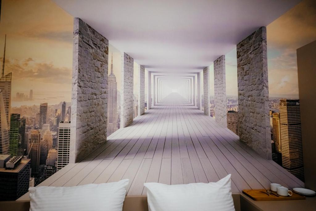 Postel nebo postele na pokoji v ubytování Chief Hotel