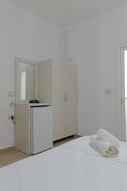 Postel nebo postele na pokoji v ubytování Hotel Veliaj