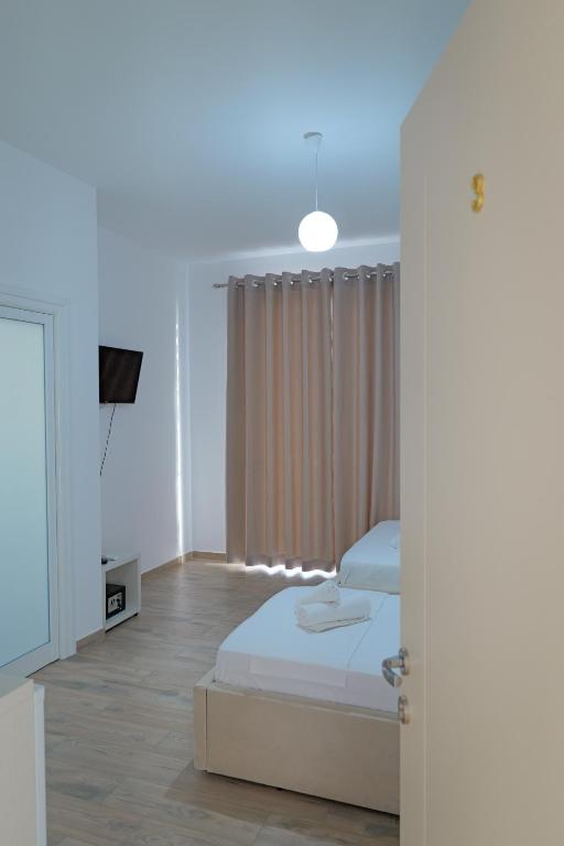 Postel nebo postele na pokoji v ubytování Hotel Veliaj