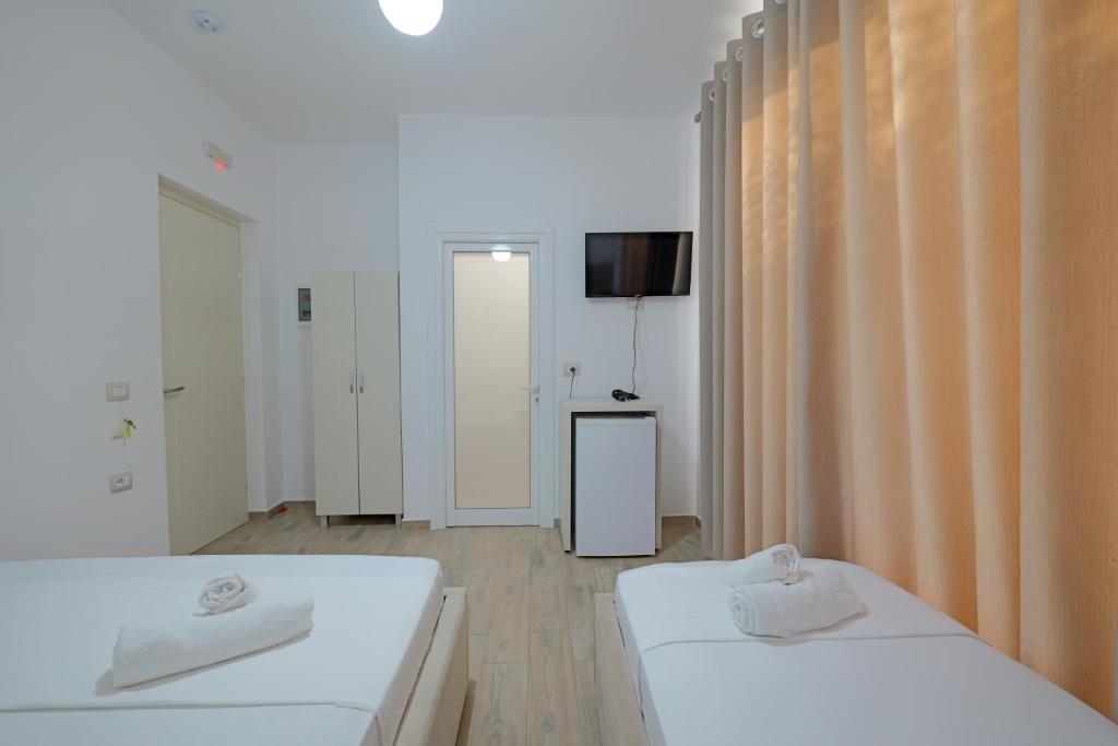 Postel nebo postele na pokoji v ubytování Hotel Veliaj