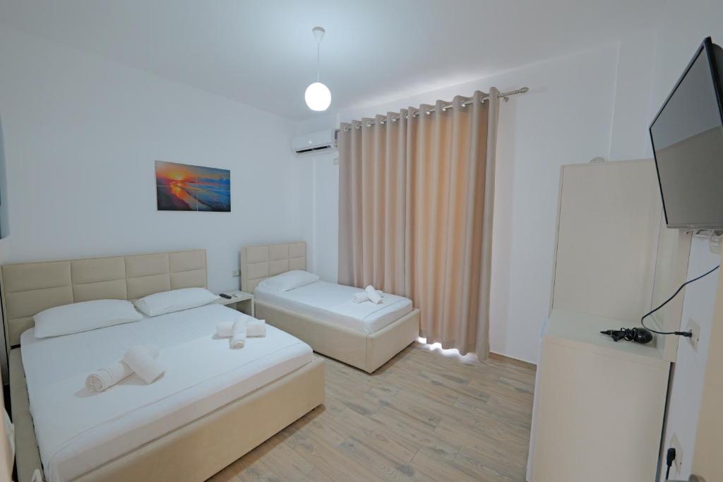 Postel nebo postele na pokoji v ubytování Hotel Veliaj