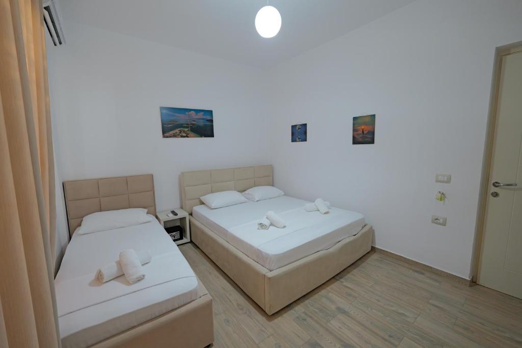 Postel nebo postele na pokoji v ubytování Hotel Veliaj