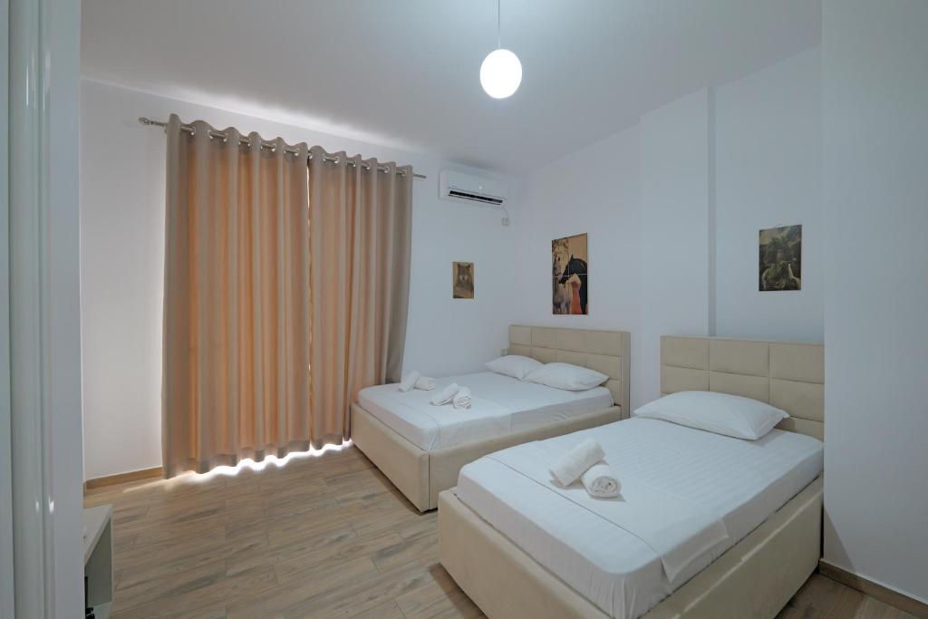 Postel nebo postele na pokoji v ubytování Hotel Veliaj