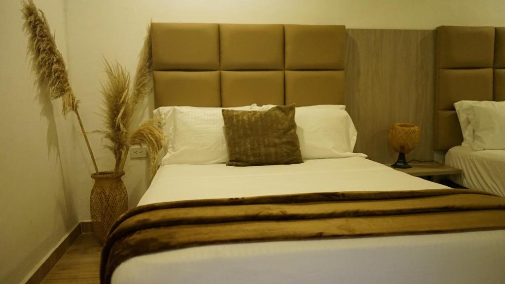 Postel nebo postele na pokoji v ubytování Dreams Hotel y Restaurante