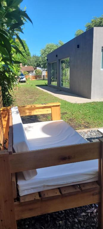 a bed sitting on the ground in a yard at Lamerced in Mar de Cobo