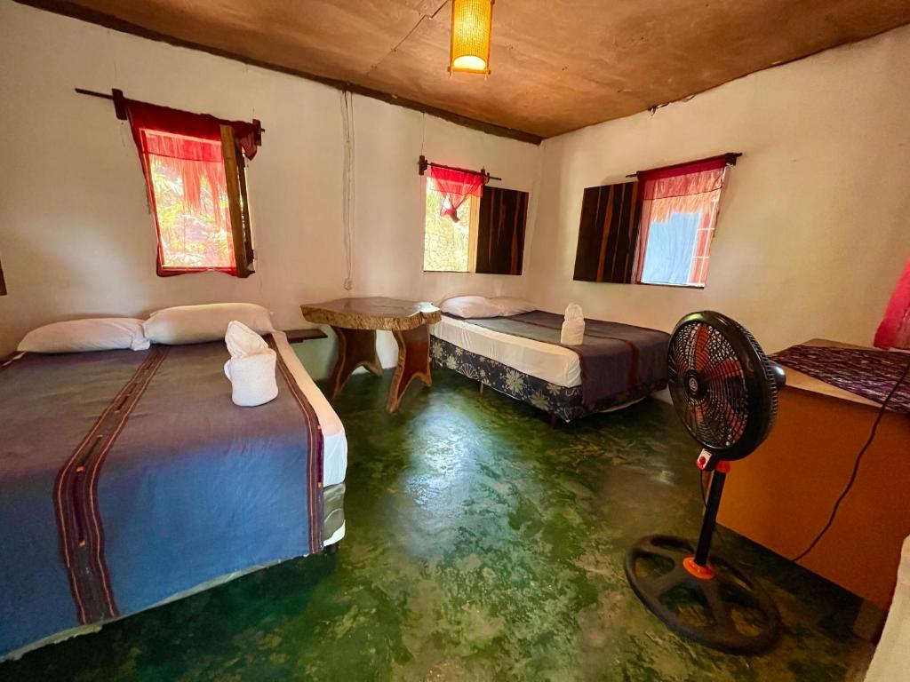 Postel nebo postele na pokoji v ubytování Hotel Mon Ami