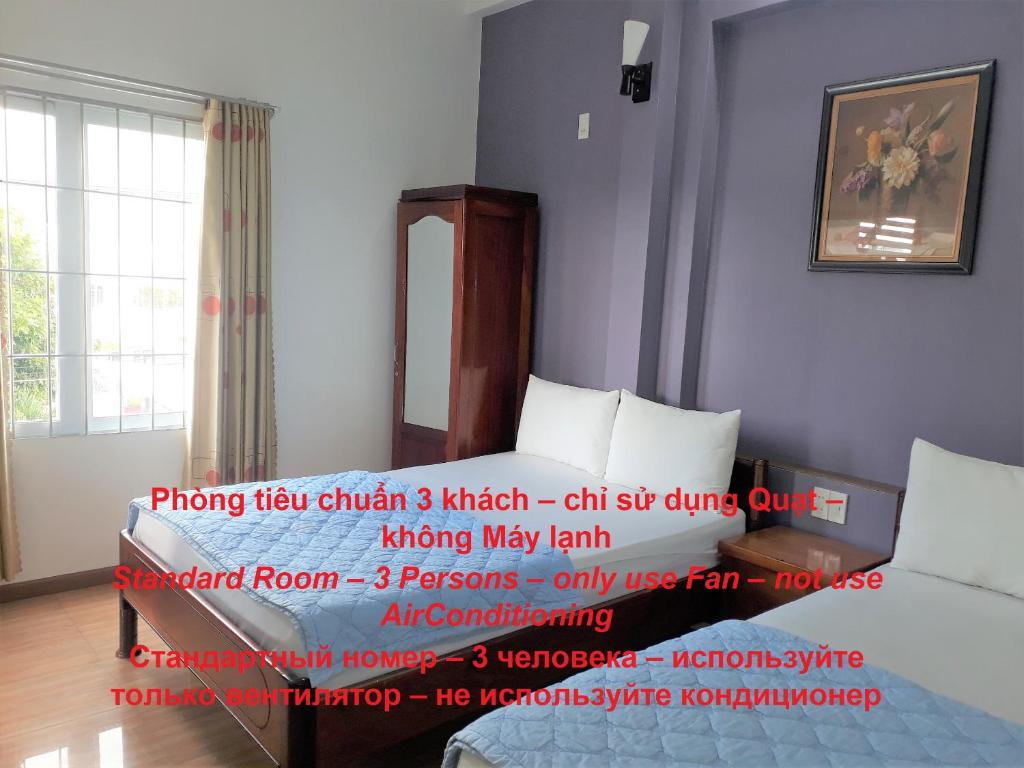 Postel nebo postele na pokoji v ubytování Blue Sea Hotel 2