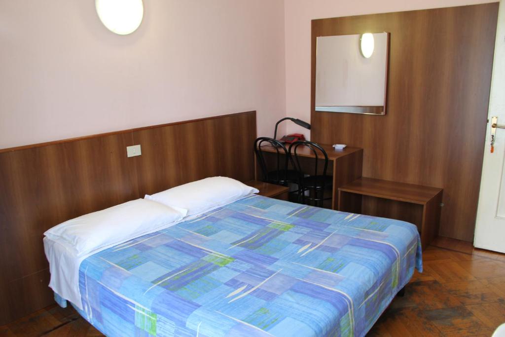 Postel nebo postele na pokoji v ubytování Hotel Rallye
