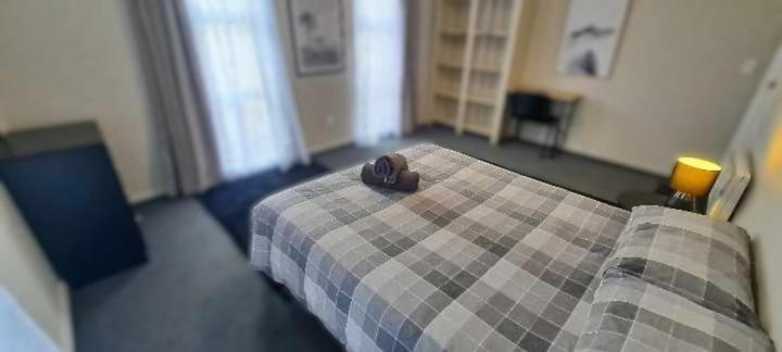 Postel nebo postele na pokoji v ubytování Tō Tātou Kainga
