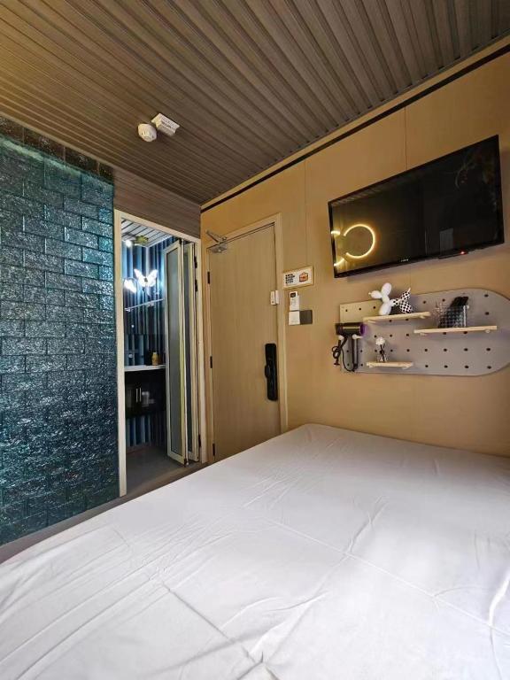 Postel nebo postele na pokoji v ubytování 榆迪賓館 YUTIK Guesthouse
