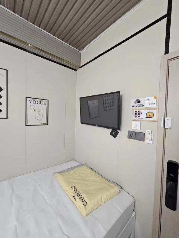 Postel nebo postele na pokoji v ubytování 榆迪賓館 YUTIK Guesthouse