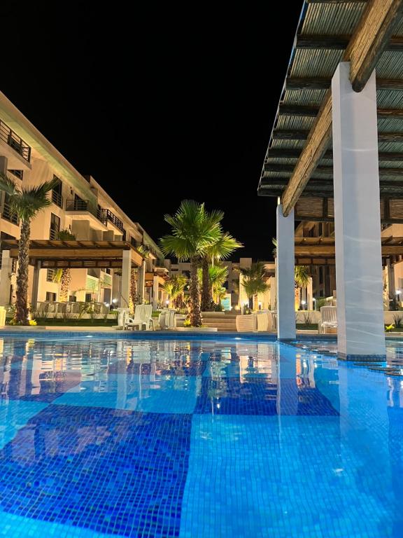 a view of a swimming pool at night at Departamento en Mazatlán in Mazatlán