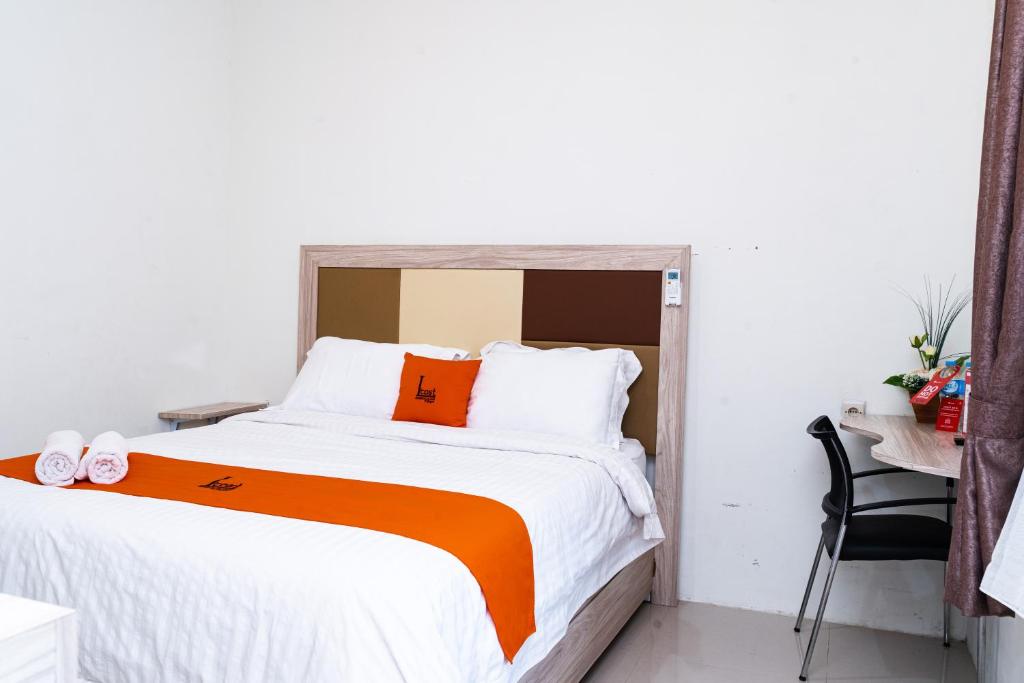 Postel nebo postele na pokoji v ubytování L'cost Homestay