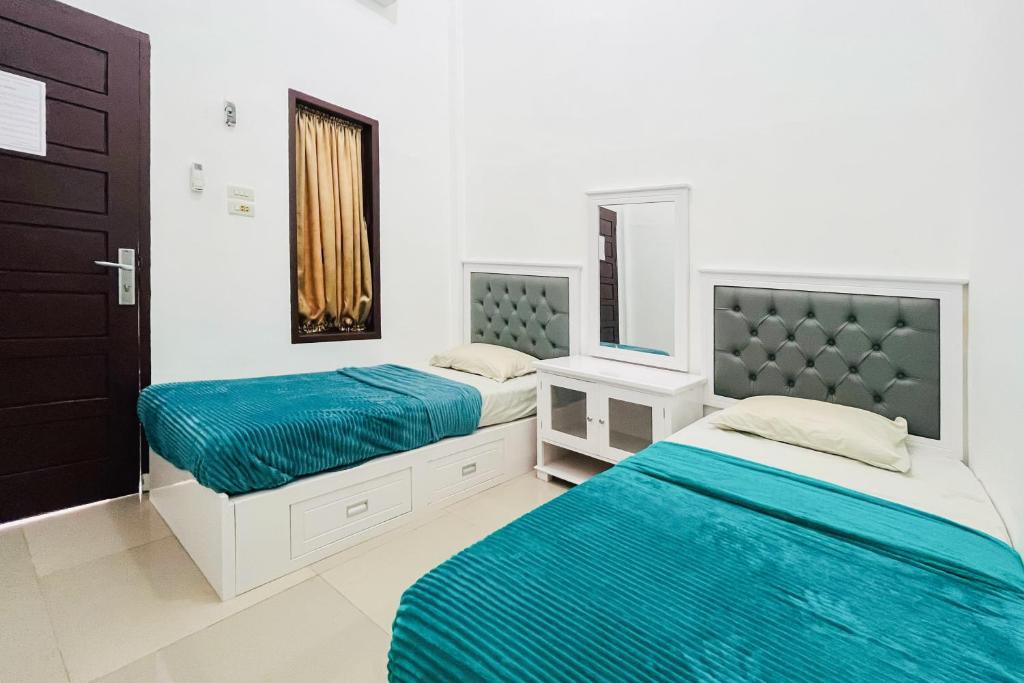 De Farasat Hotel Syariah RedPartner - Habitación Gemela