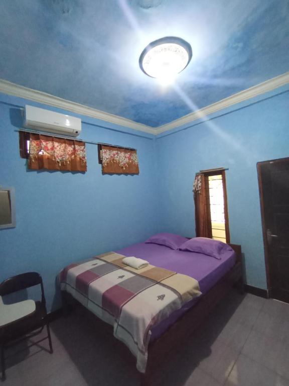Postel nebo postele na pokoji v ubytování Pedek Homestay