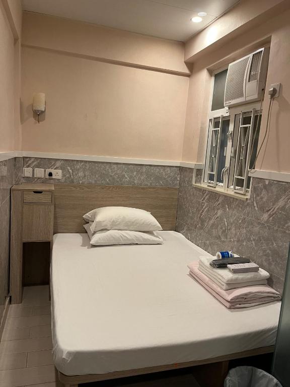 Letto o letti in una camera di 3D Inn Hong Kong Romance