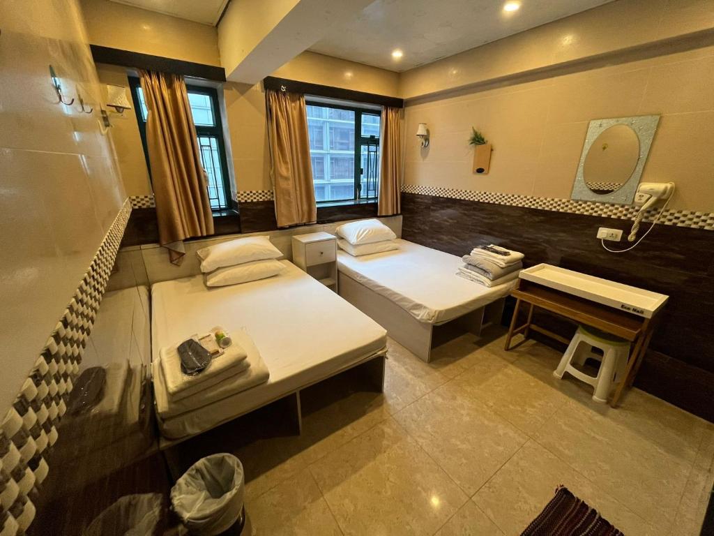 Letto o letti in una camera di 3D Inn Hong Kong Romance