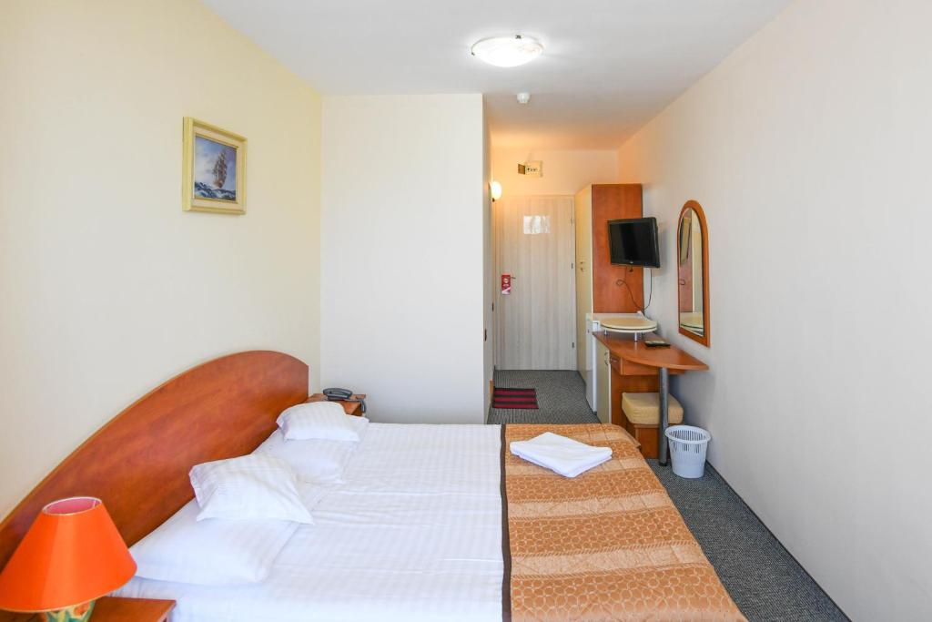 Postel nebo postele na pokoji v ubytování Hotel Rio