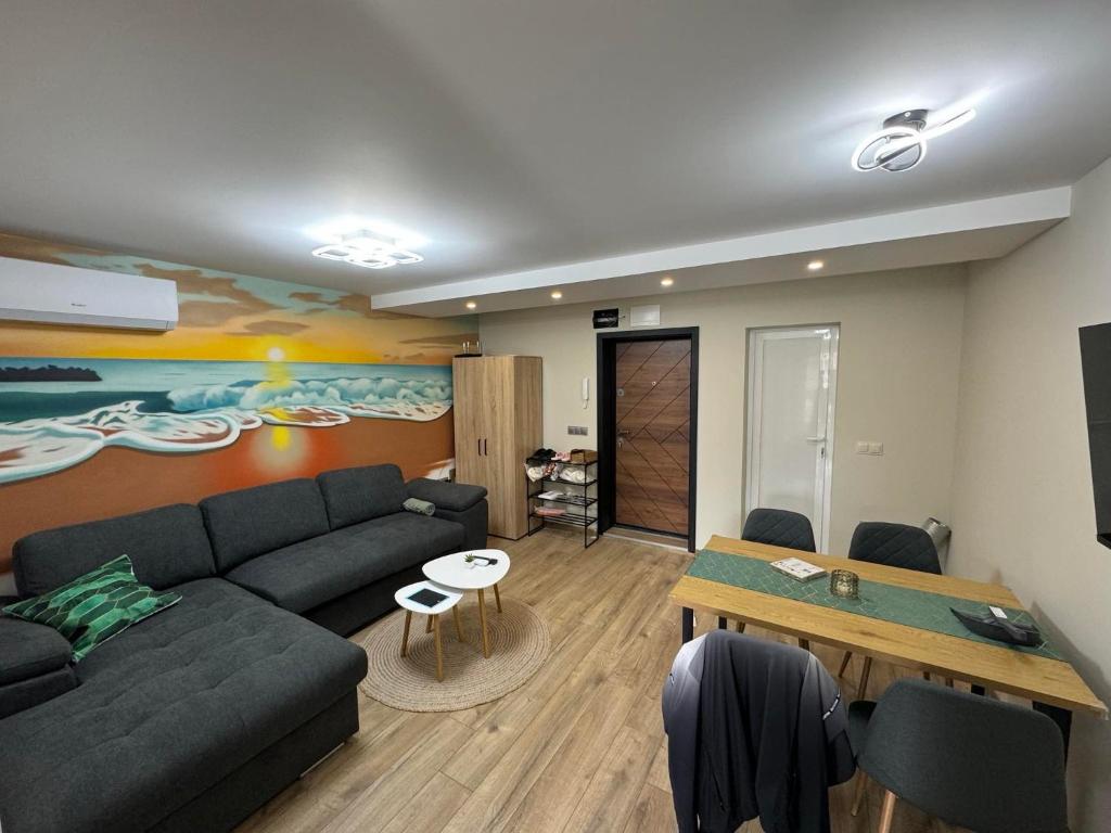 a living room with a couch and a table at Sea Treasure in Varna City