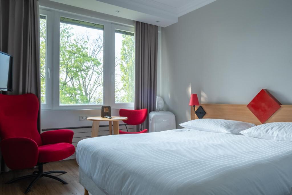 Postel nebo postele na pokoji v ubytování Hotel Parc Belle-Vue