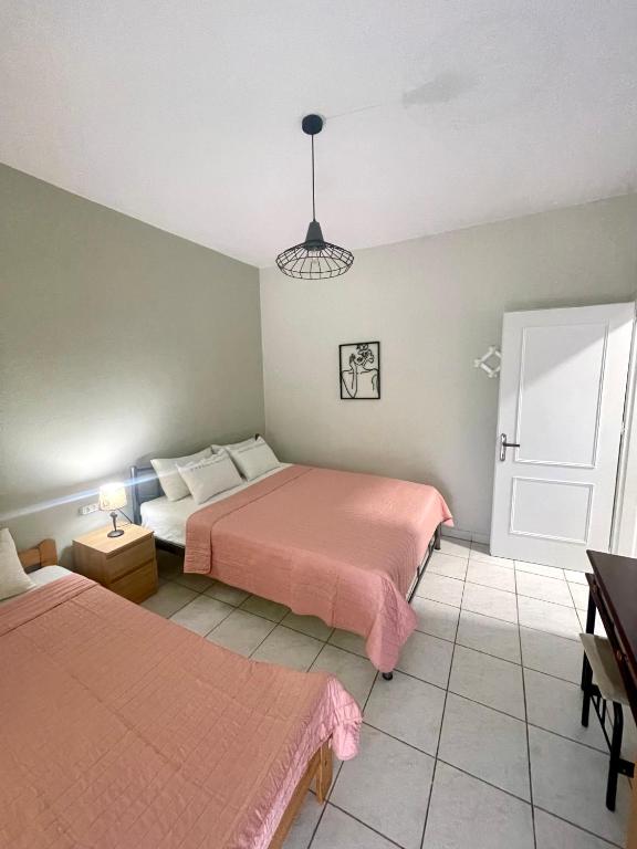 Postel nebo postele na pokoji v ubytování Nano’s home