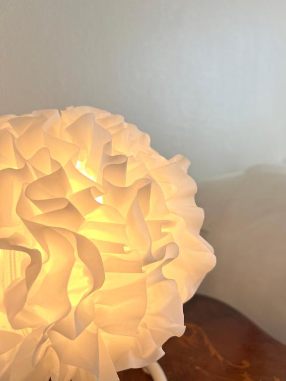 a white lamp sitting on top of a table at L'Isly, Dernier étage en centre de Rennes avec terrasse de 50m2 in Rennes