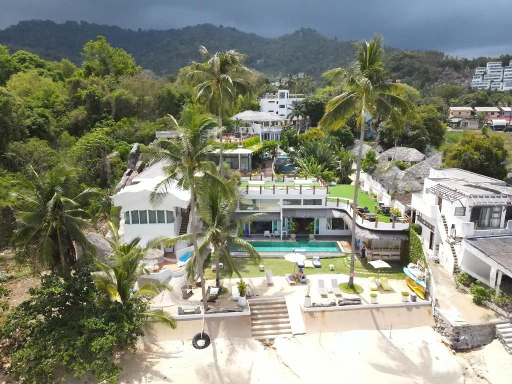 an aerial view of a house with a swimming pool at The Rock Samui in Lamai