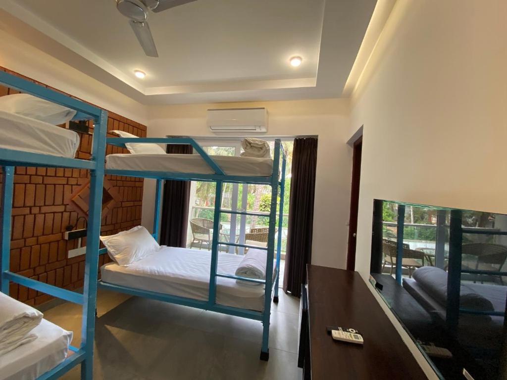 Postel nebo postele na pokoji v ubytování DownTown Hostels - Anjuna