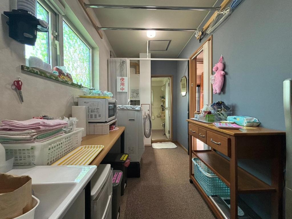 Kuchyň nebo kuchyňský kout v ubytování Guest House モモ