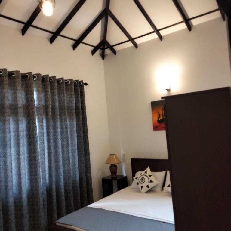 Postel nebo postele na pokoji v ubytování R & R Home Stay