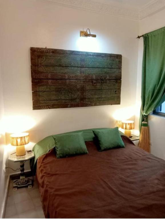Postel nebo postele na pokoji v ubytování Riad EL BADI
