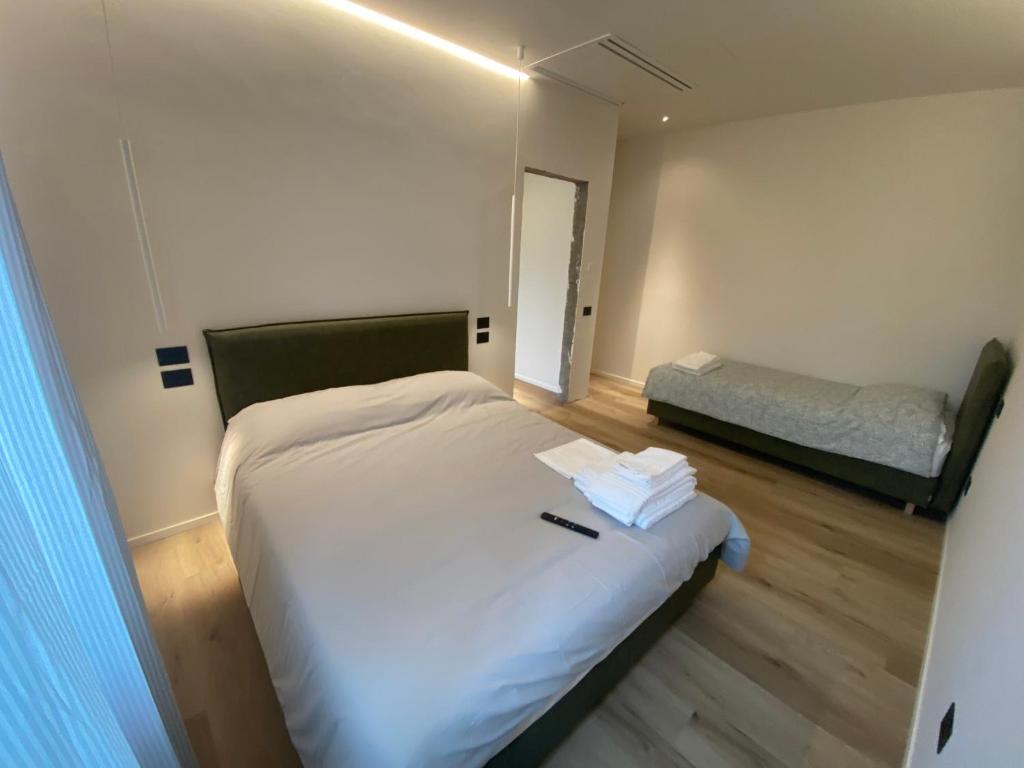 Postel nebo postele na pokoji v ubytování Prato della Valle Apartments
