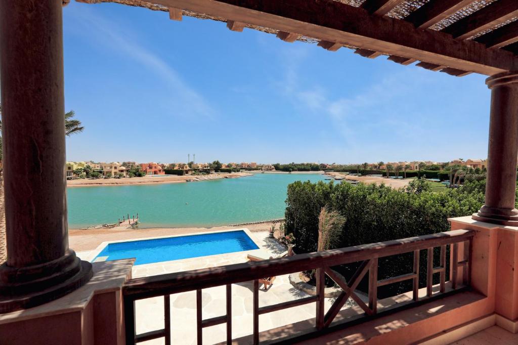 a view from the balcony of a house with a swimming pool at Charming Lagoon Villa with pool Egyptian Style -Sabina 117 in Hurghada