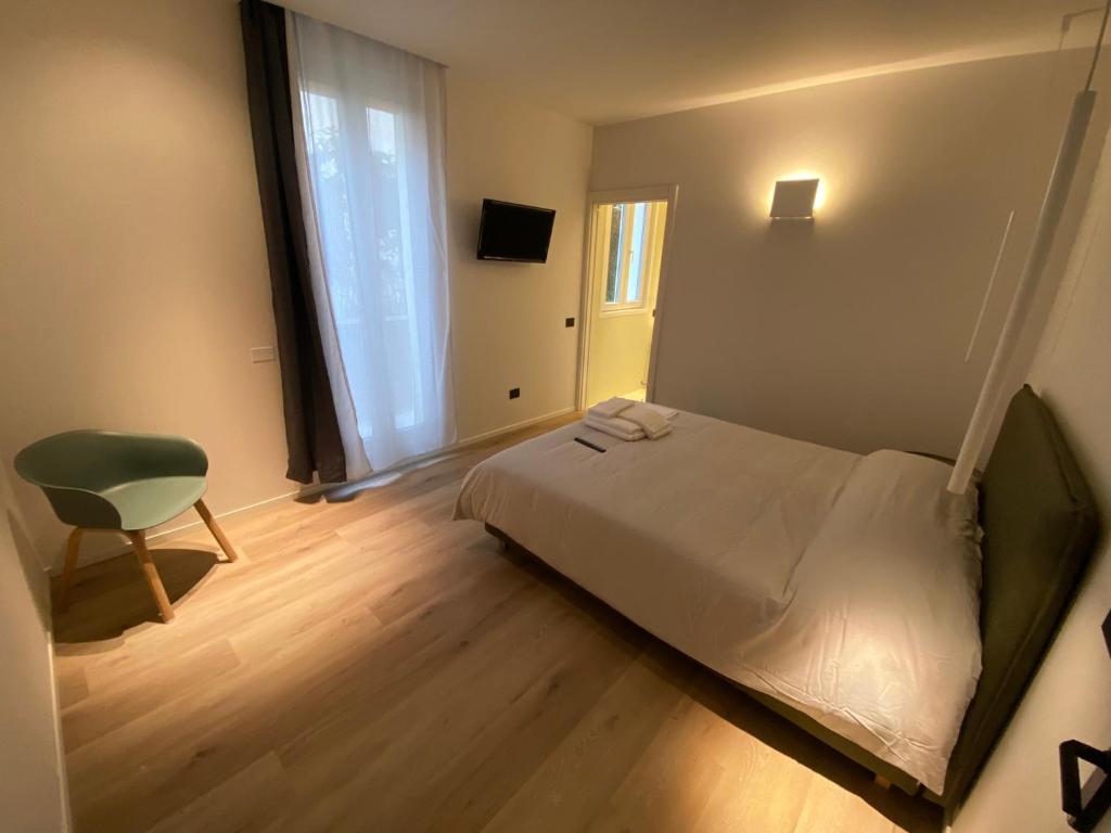 Postel nebo postele na pokoji v ubytování Prato della Valle Apartments